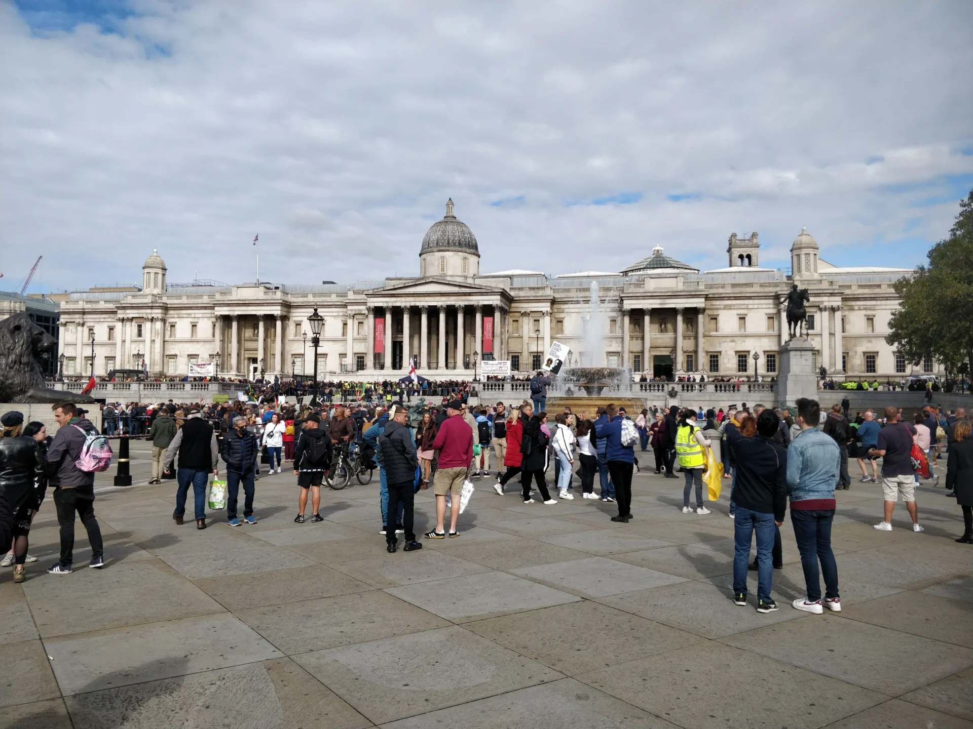 Gathering of people outside the National Gallery, Trafalgar Square, resembling a protest—capturing London’s ever-moving energy